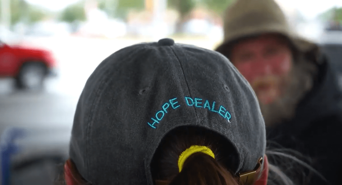 Close-up on back of baseball cap with embroidered text that says hope dealer