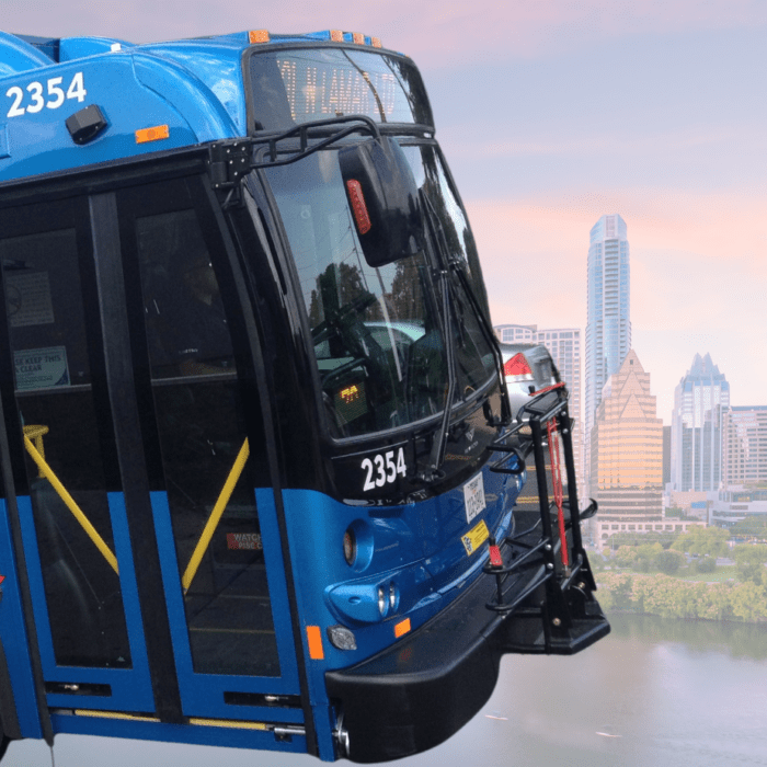 Photo of Capital Metro bus on top of Austin skyline