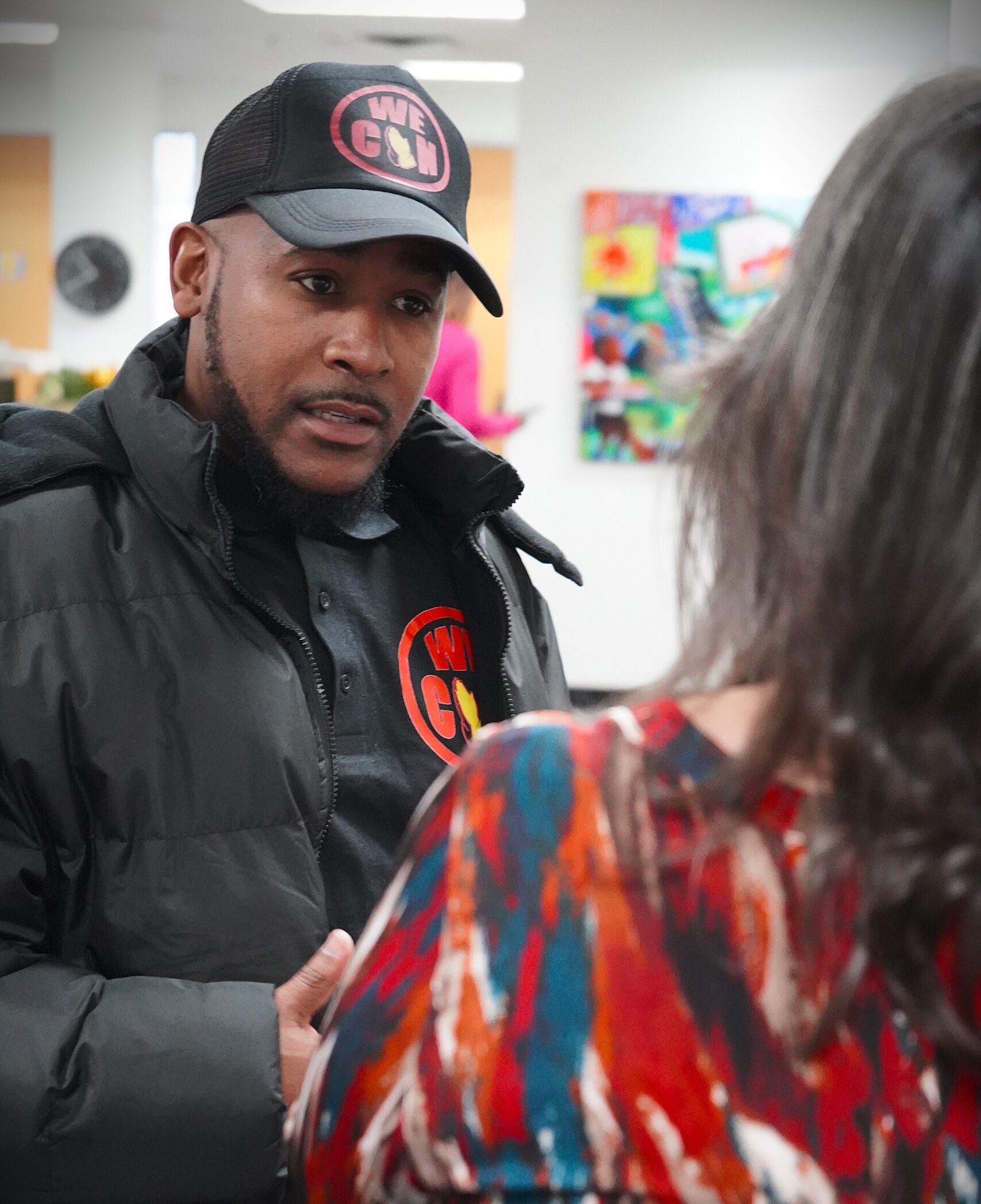 Antony Jackson talks to someone whose back in turned to the camera